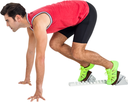 Confident male athlete in ready to run position
