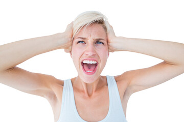Angry blonde screaming and holding her head 