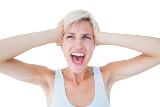 Angry blonde screaming and holding her head 