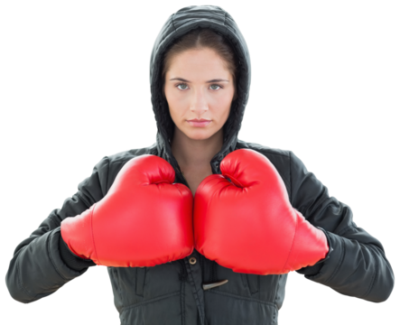 Serious young woman in red boxing gloves and black hood - Powered by Adobe