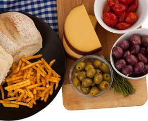 Olives with vegetable and french fries in plate