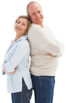 Mature couple standing and smiling at camera