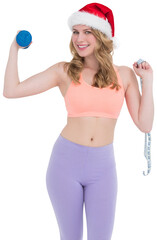 Smiling fit blonde holding dumbbell and measuring tape