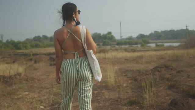 Beautiful Independent Indian Woman Walks Outside, wearing Sunglasses Slow Motion