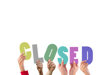 Colorful alphabet spelling closed held up by people  