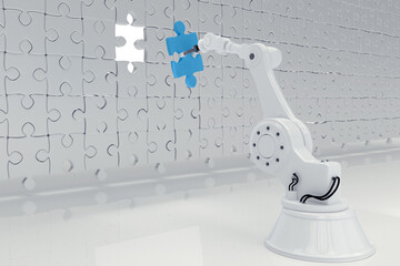 Robotic hand putting blue jigsaw piece on puzzle