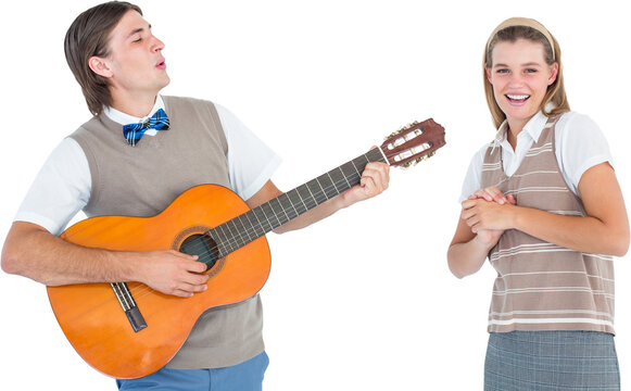 Geeky hipster serenading his girlfriend with guitar 