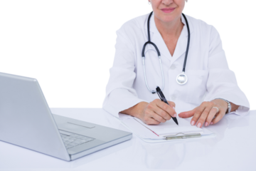 Midsection of female docotor writing prescription at desk