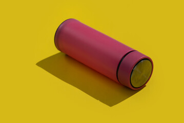 Pink empty traveler bottle & drink container template on yellow background