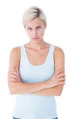 Upset blonde looking at camera with arms crossed 