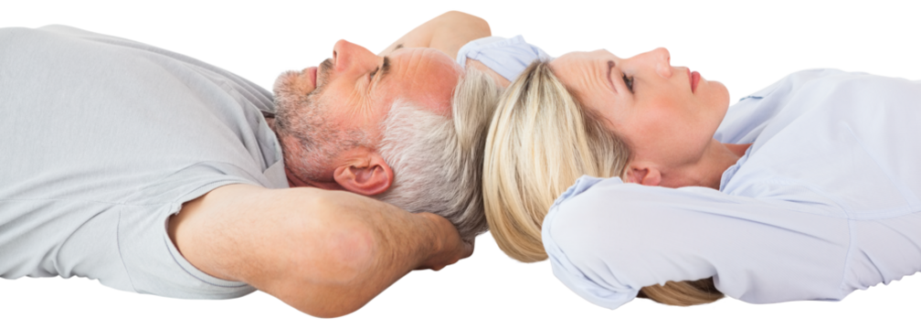 Couple relaxing while lying on floor