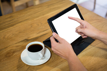 Cropped hands holding digital tablet