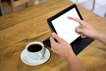Cropped hands holding digital tablet