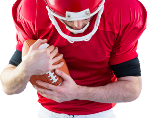 American football player protecting football