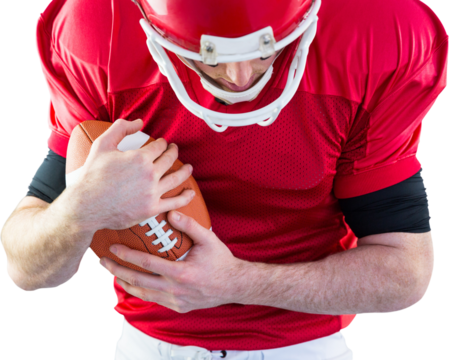 American football player protecting football