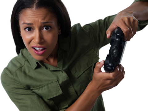 Woman making funny faces while playing video games