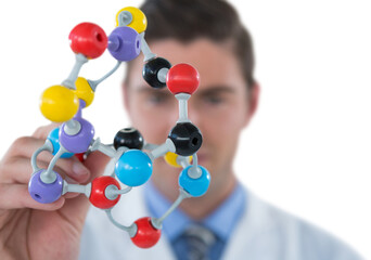 Scientist holding multi colored molecule structure