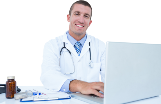 Portrait of smiling businessman using laptop