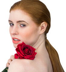 Beautiful redhead posing with red rose