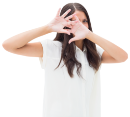 Fearful brunette covering her face