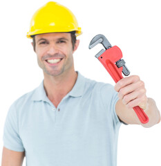 Happy carpenter holding monkey wrench