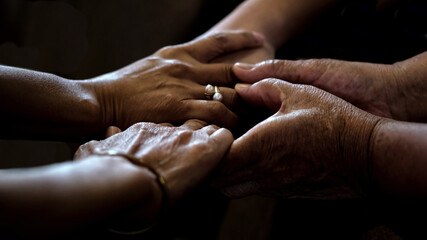 Praying hands together at Church.
