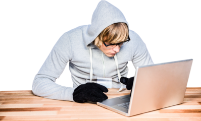 Man in hood jacket hacking a laptop