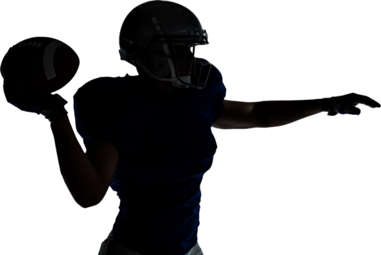Silhouette American football player throwing ball