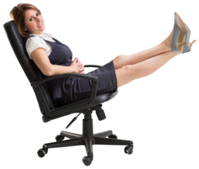 Portrait of smiling businesswoman relaxing on swivel chair