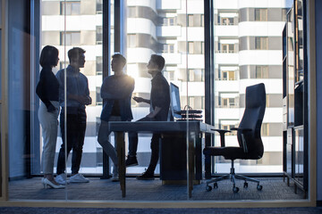 Confident Chinese designers having a meeting