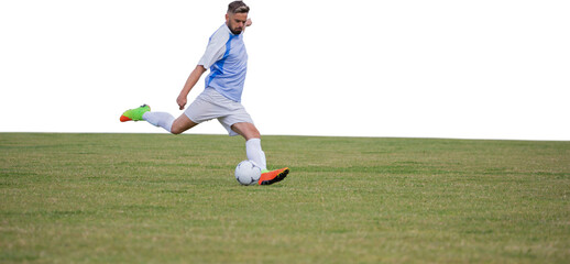 Male soccer player playing football