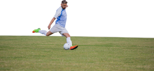 Male soccer player playing football