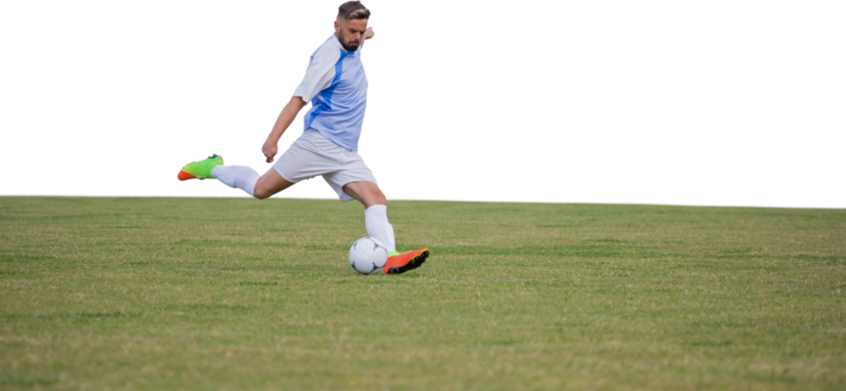 Male soccer player playing football
