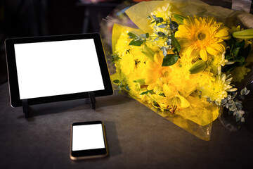 Technology with yellow flower bouquet