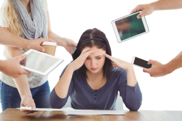 Depressed businesswoman with head in hands