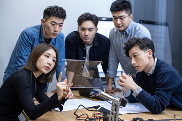 Confident Chinese designers having a meeting