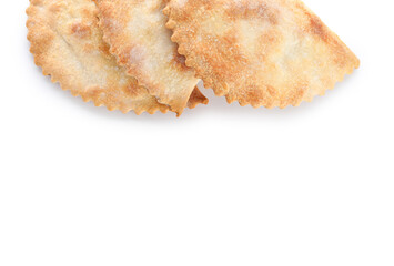 Baked meat empanadas on white background, closeup