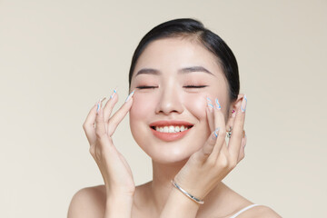 Happy young woman face with clear skin on brown background, closeup portrait