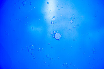 Air bubbles in the water background.Abstract oxygen bubbles in the sea.Water bubbles isolate on blue background.