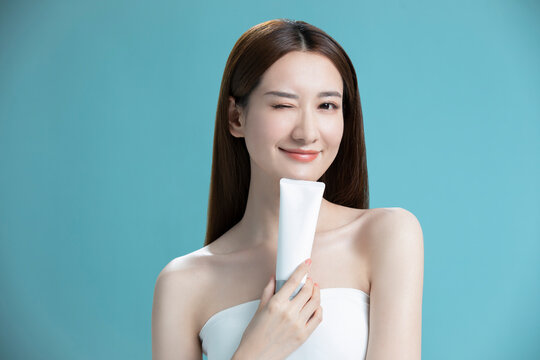 Beautiful young Chinese woman with face wash