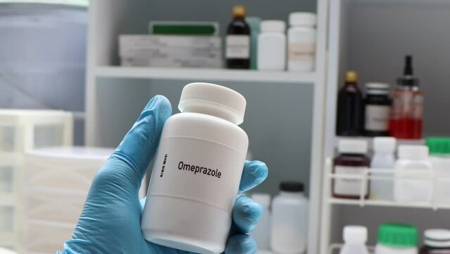 Omeprazole pill in white bottle, pill stock, medical or pharmacy concept