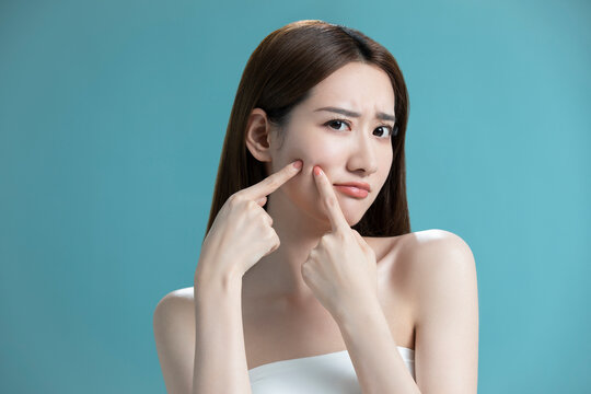 Studio shot of beautiful young Chinese woman