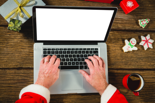 Santa Claus using laptop