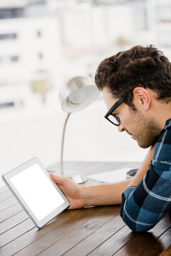 Man looking at digital tablet