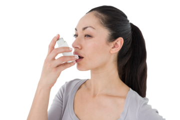 Asthmatic pretty brunette using inhaler 