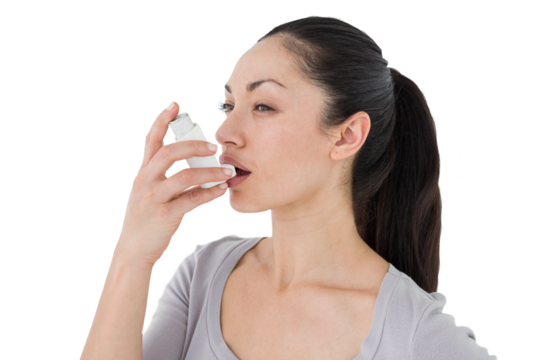 Asthmatic pretty brunette using inhaler 