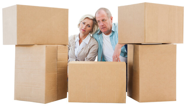 Stressed Older Couple With Moving Boxes