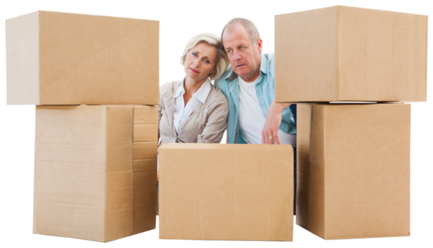 Stressed older couple with moving boxes
