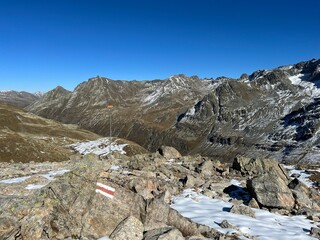 Alpine mountaineering signposts and markings in the mountainous area of the Albula Alps and above the Swiss mountain road pass Fluela (Fl&uuml;elapass), Zernez - Canton of Grisons, Switzerland (Schweiz)