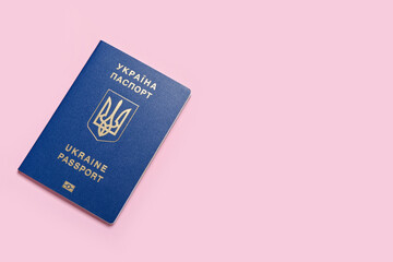 Ukrainian passport on pink background